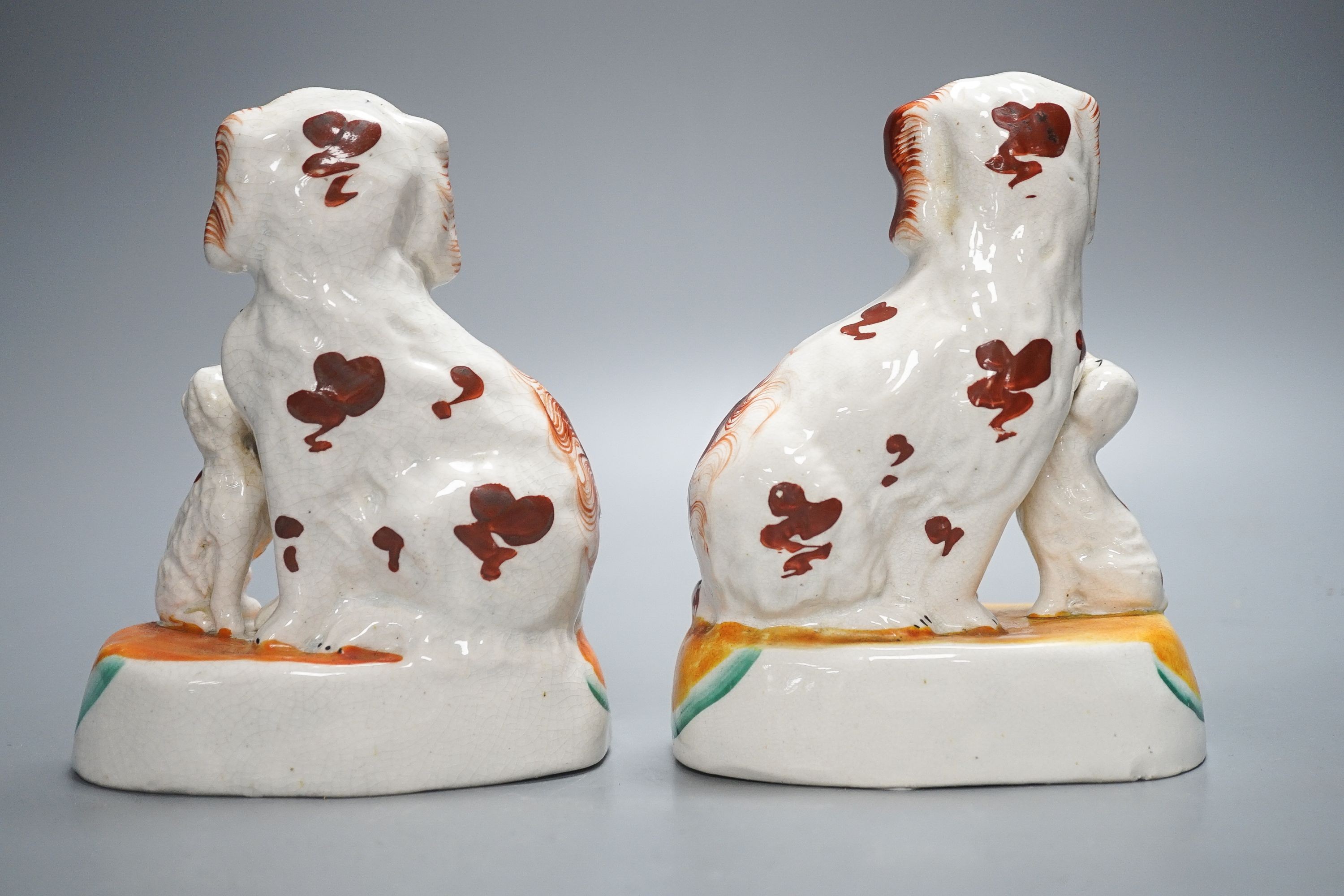 A pair of Staffordshire spaniel and puppy groups, 15cm high